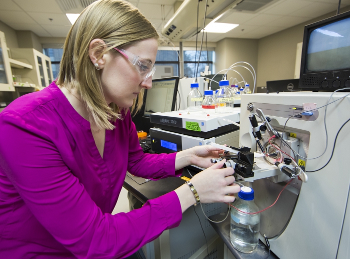 Mallory Ladd uses liquid chromatography and high-resolution mass spectrometry to characterize the molecular composition of nitrogen in soil samples from a polygonal tundra near Barrow, Alaska. Photo courtesy of Joy Anderson, ORNL.