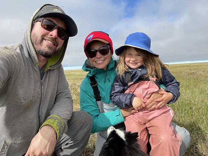 Figure 2. The summer 2023 field crew at the Teshekpuk Lake Observatory, from left to right: Benjamin Jones, Melissa Ward Jones, Lillian Jones, and Kaya (in front). Photo courtesy of Ben Jones.